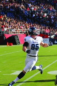 Redshirt sophomore tight end Ross Dwelley looks into the sun to find the ball. Photo Courtesy of Ian Lituchy/The Vista